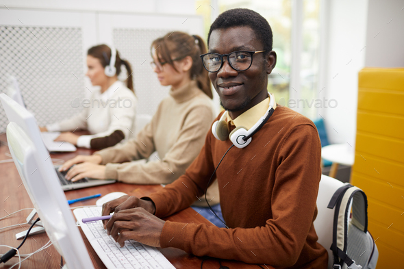 African-American Student Using Computer in College