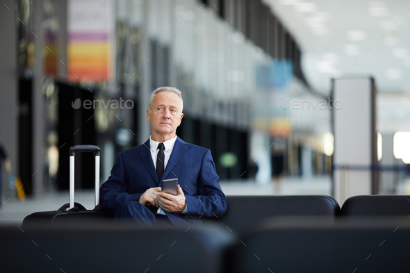 Senior Businessman Waiting in Airport