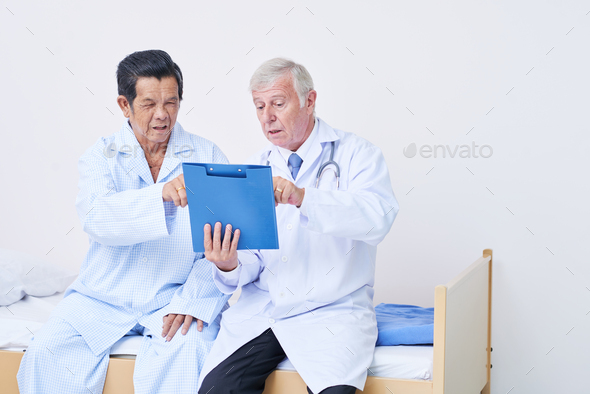 Doctor and senior patient discussing medical history