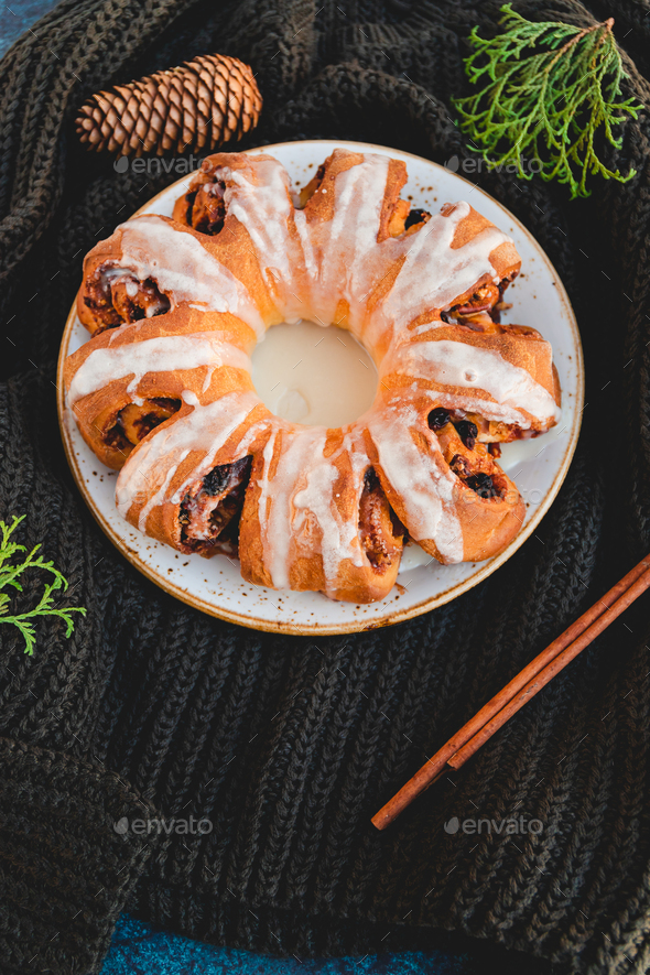 Creative flat lay, top view of Swedish tea ring Christmas cake - Stock Photo - Images