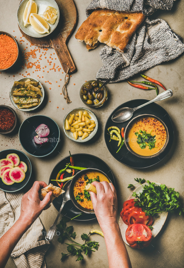 Turkish traditional lentil soup Mercimek and hands adding lemon juice - Stock Photo - Images