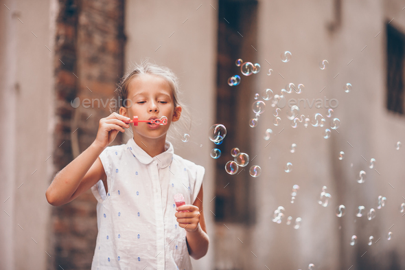 Adorable fashion little girl outdoors in European city Rome - Stock Photo - Images