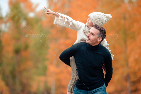 Family of dad and kid on beautiful autumn day in the park - Stock Photo - Images