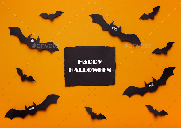Happy Halloween concept with flying bats and text