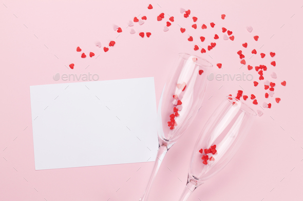 Champagne glasses, greeting card and sweets - Stock Photo - Images