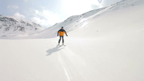 Skier Skiing in Alpine Terrain