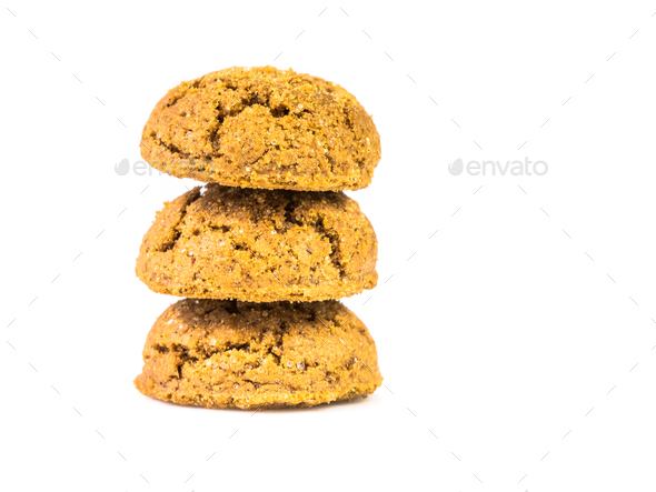Pile of three traditional pepernoten treats on white background - Stock Photo - Images