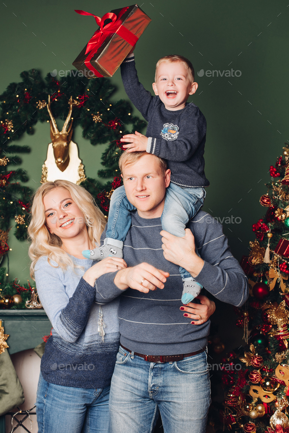 Christmas family photo, dad, son and mom - Stock Photo - Images