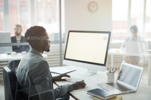 Young African Businessman at Workplace - Stock Photo - Images