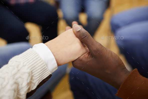 Holding Hands in Support Group Close up