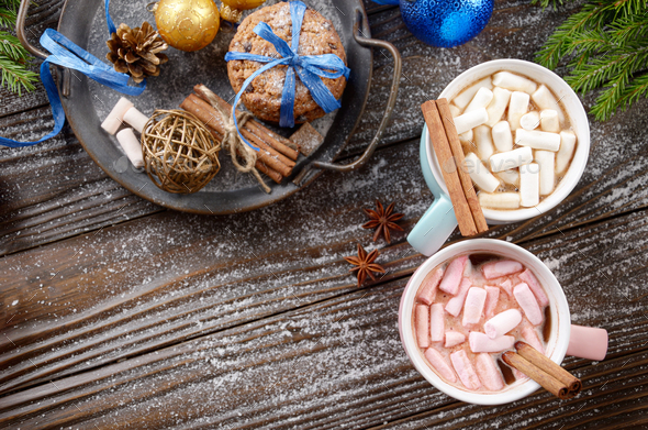 Flat lay Christmas background of two mugs of hot chocolate with - Stock Photo - Images