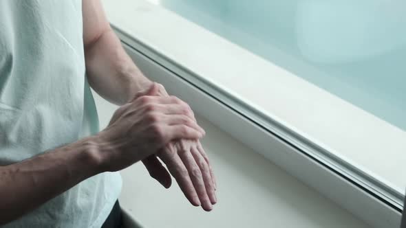 Closeup with Man's Hand Using Hand Cream to Care About Skin alt