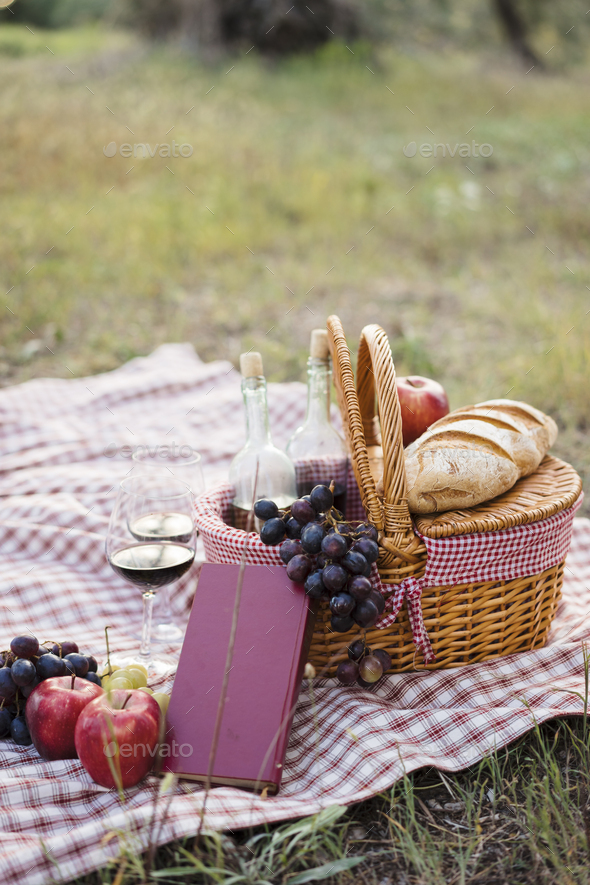 Couple doing a romantic picnic in Tuscany countryside Stock Photo by jpozzi