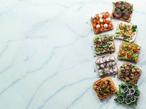 Assortment vegan sandwiches on white marble - Stock Photo - Images