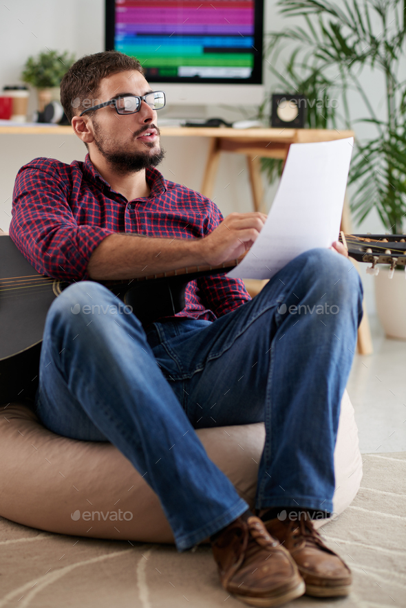 Musician composing music - Stock Photo - Images