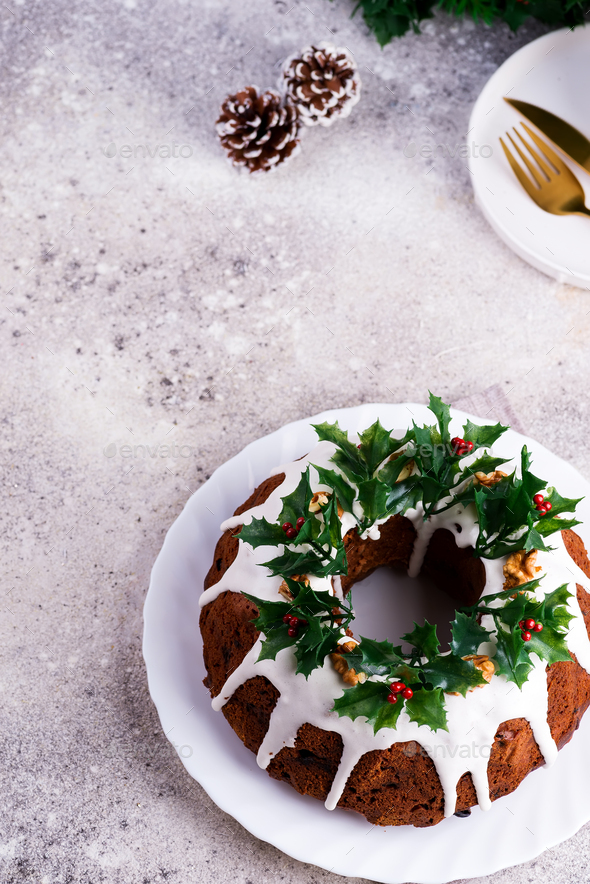 Christmas Homebaked Dark Chocolate Bundt Cake Decorated With White Icing And Holly Berry Branches On Stock Photo By Lyulkamazur