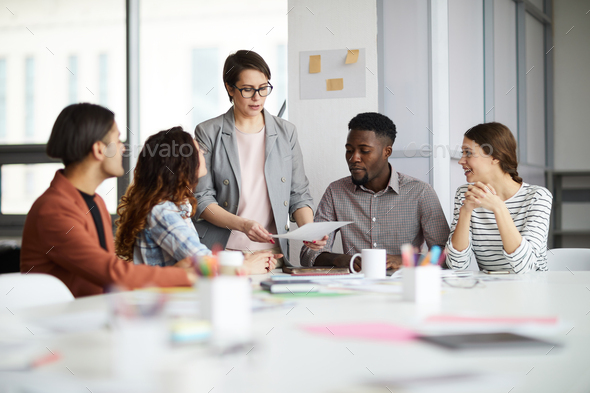 Female Manager Working with Creative Team - Stock Photo - Images