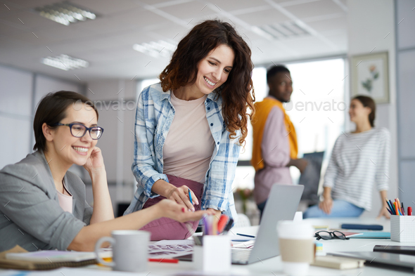 Smiling Businesswoman Working in Office - Stock Photo - Images