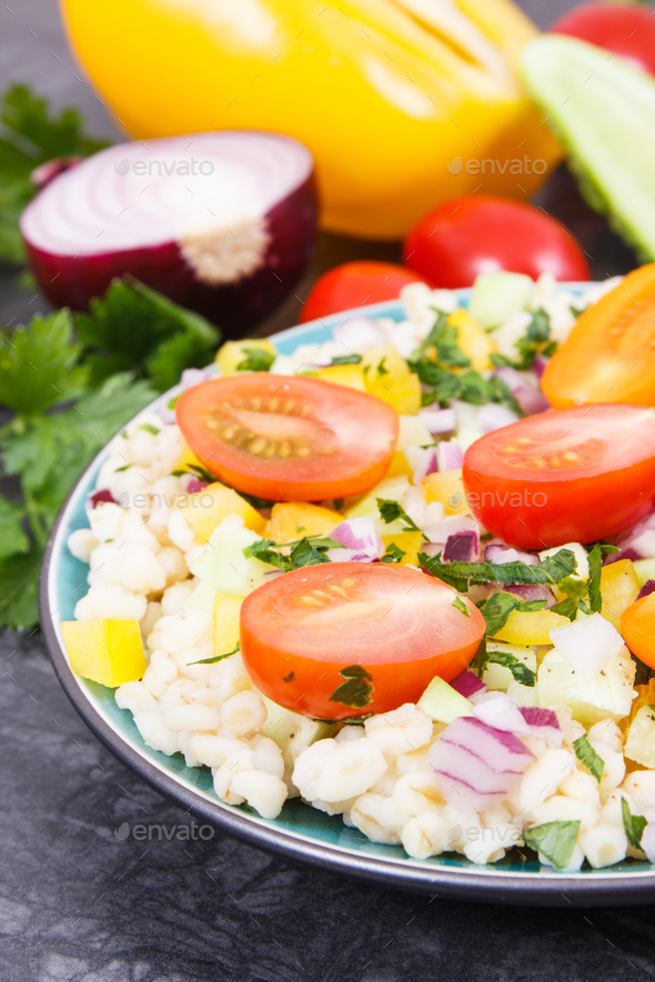 Fresh salad with bulgur groats and vegetables as best food for dieting and slimming - Stock Photo - Images