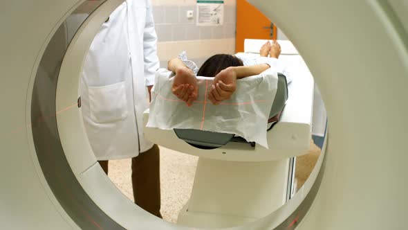 A patient is loaded into an mri machine alt