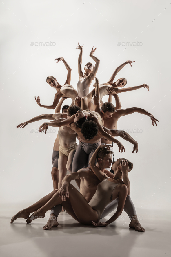 The group of modern ballet dancers. Contemporary art ballet. Young flexible athletic men and women - Stock Photo - Images