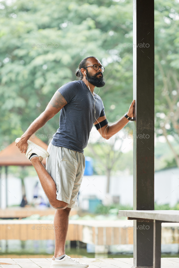 Male Runner Warming Up - Stock Photo - Images
