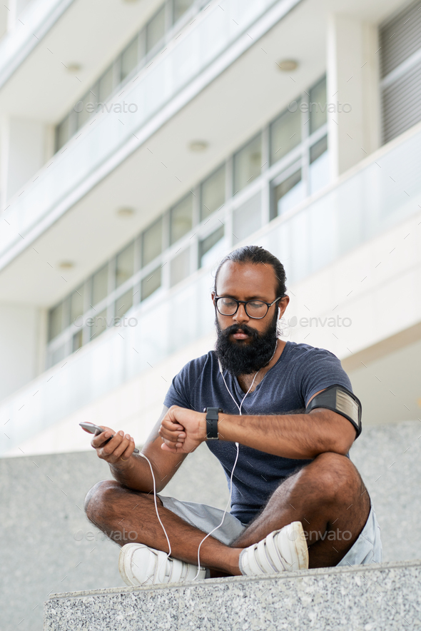 Sportsman Checking Time - Stock Photo - Images