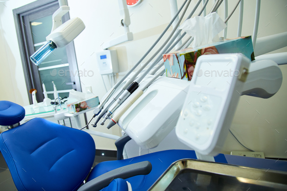 Modern metallic dentist tools and burnishers on a dentist chair - Stock Photo - Images