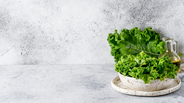 Kale leaves in bowl, copy space left - Stock Photo - Images