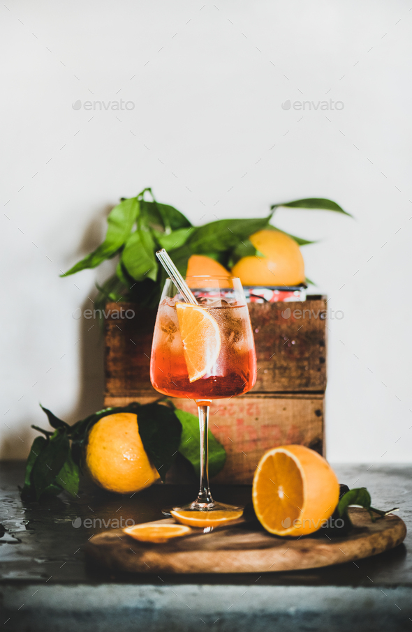 Aperol Spritz cocktail in glass with eco-friendly straw, copy space Stock  Photo by sonyakamoz