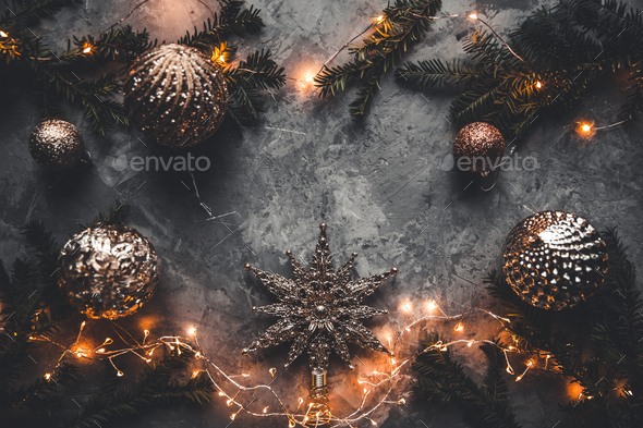 Holiday frame of Christmas decorations on blue dark stucco concrete background with fir branch - Stock Photo - Images