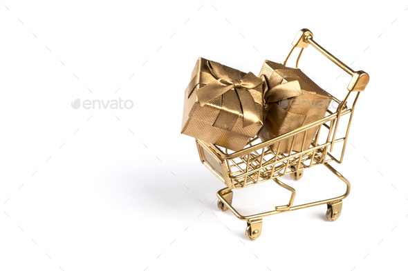Shopping cart trolley basket gold color with gifts. - Stock Photo - Images