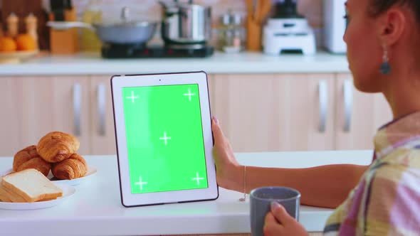 Holding Tablet Pc with Chroma Key alt