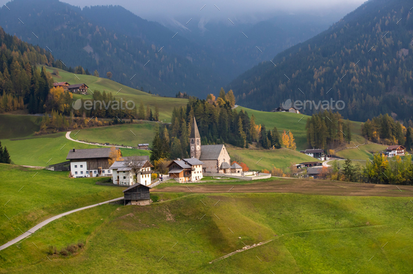Green alpine valley with view of Santa Maddalena village church, - Stock Photo - Images