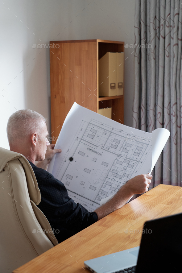 Man Checking Construction Plan - Stock Photo - Images
