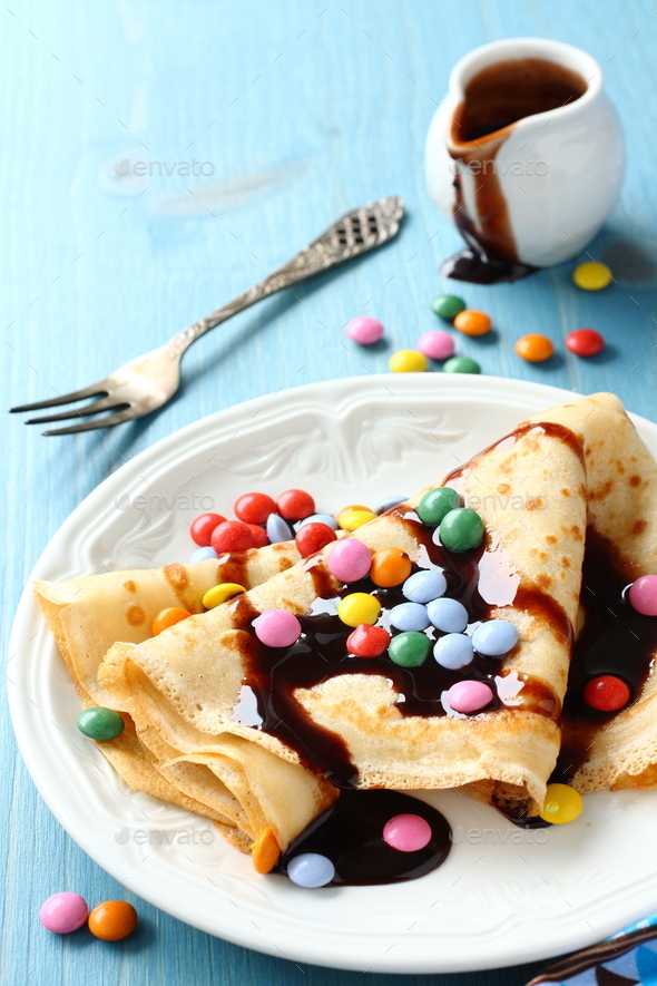 Homemade crepes with multicolored dragee - Stock Photo - Images