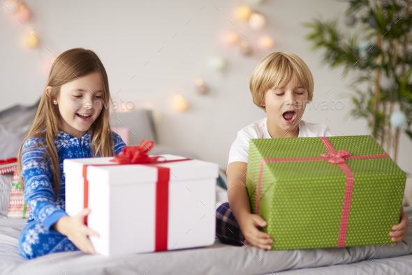 Happy kids with Christmas presents Stock Photo by gpointstudio | PhotoDune