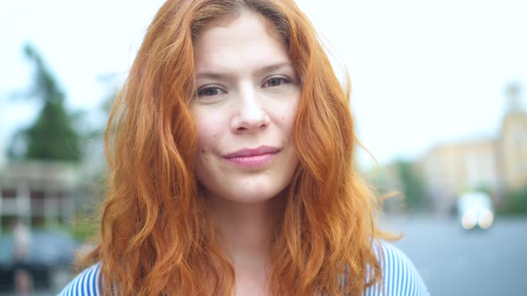 Wonderful Redhead Woman with a Lovely Look and Natural Make up Looking at Camera  alt