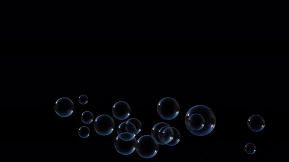 Soap Bubbles Fly Up Slow on Black Background
