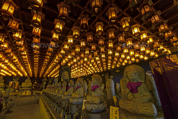 Thousands of lanterns hanging on the ceiling of Buddhist temple Shrine.