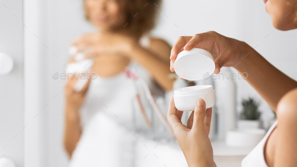 Unrecognizable Afro Girl Opening Cosmetic Cream Standing In Bathroom, Panorama