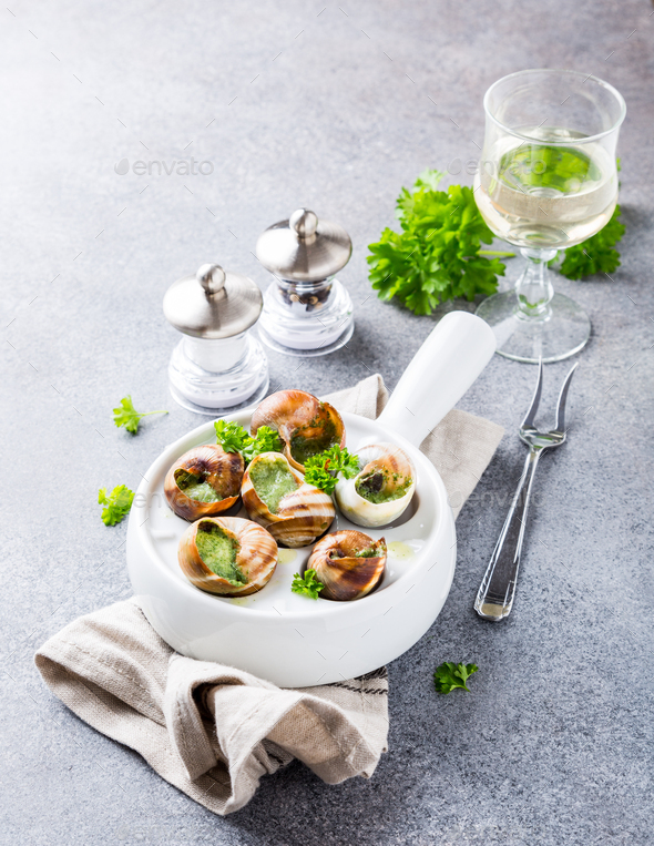 Snails with garlic herbs butter - Stock Photo - Images