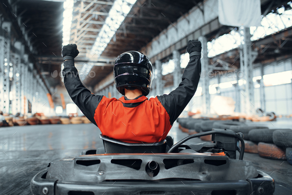 Go kart racer raised his hands up, winner, karting - Stock Photo - Images