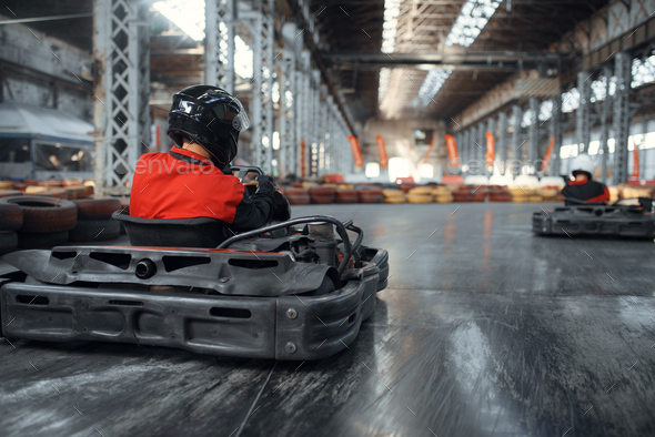 Racer in helmet driving go kart car - Stock Photo - Images