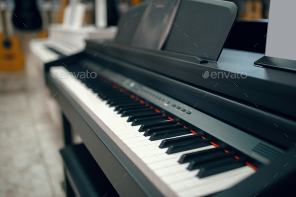 Digital piano in music store, closeup keyboard