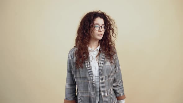 The Young Woman Snorts Then Outraged Puts Her Finger on Her Nose to Make an Angry Remark alt