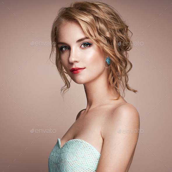 Young blonde woman with curly hairstyle - Stock Photo - Images