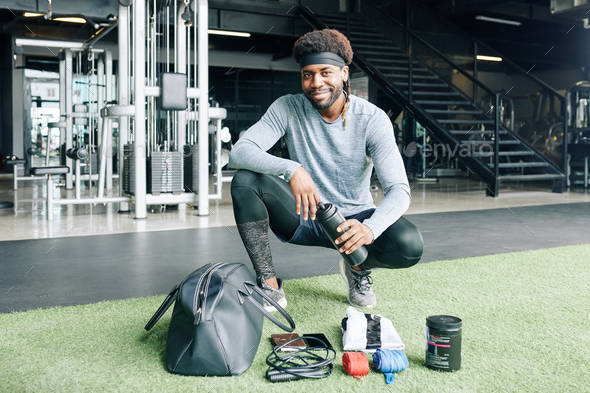 Fitness trainer with his gym bag