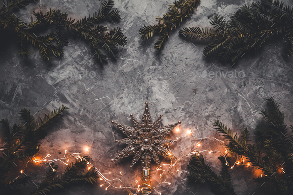 Holiday frame of Christmas decorations on blue dark stucco concrete background with fir branch - Stock Photo - Images