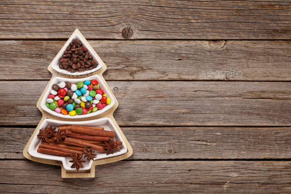 Christmas card with spices, sweets and nuts - Stock Photo - Images